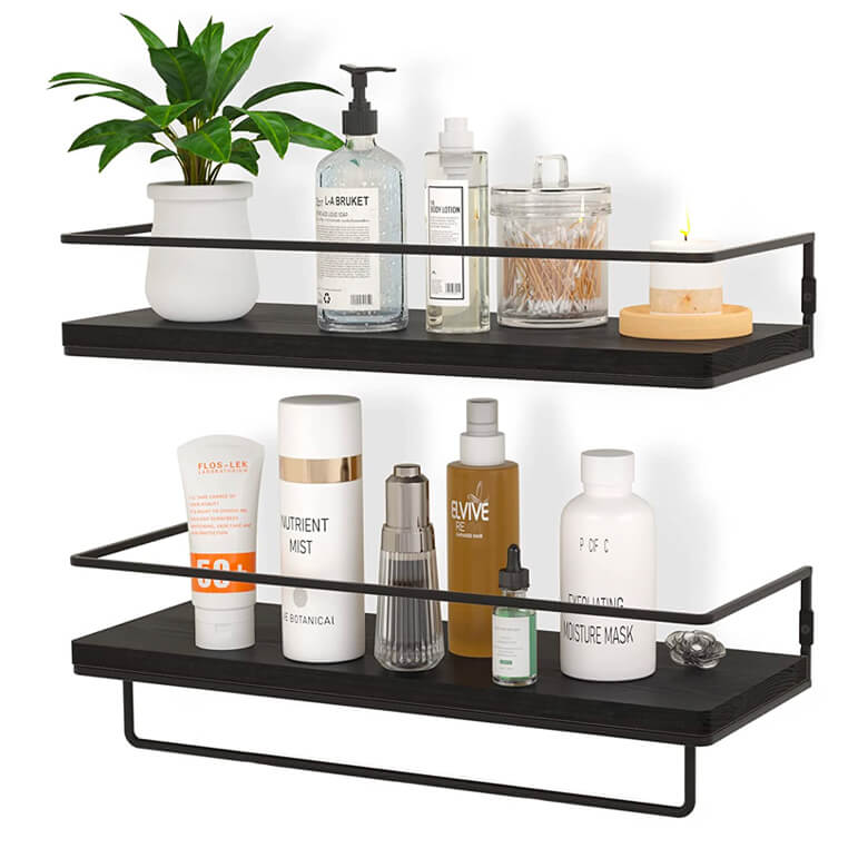 Two-tier black wall shelves holding toiletries, skincare products, and a small potted plant