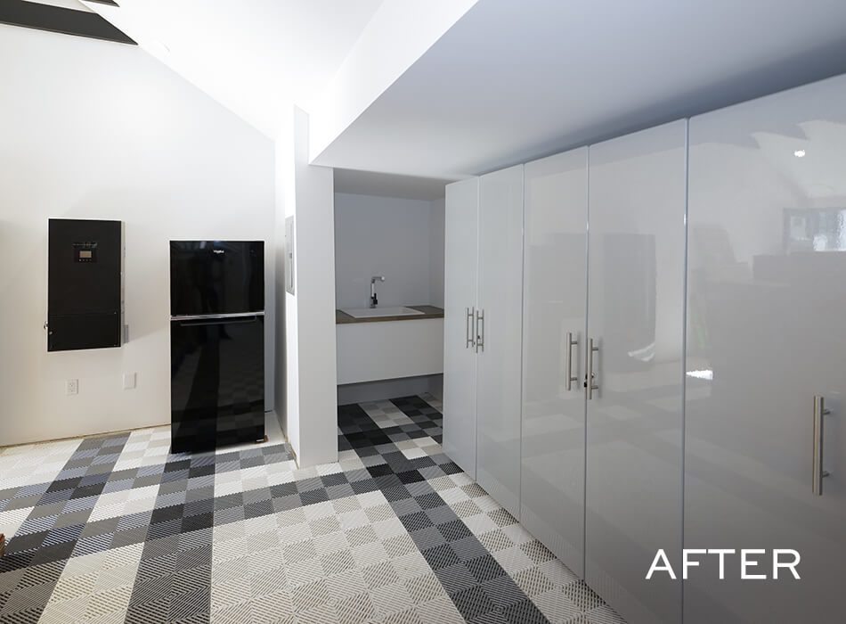 Modern room interior with glossy white cabinets, black refrigerator, and checkered flooring