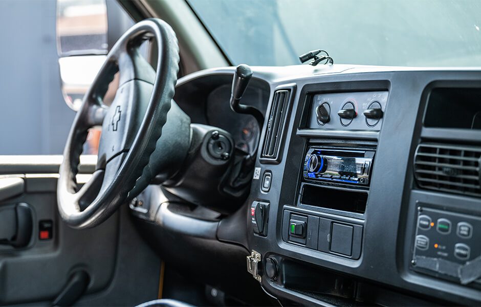 Interior view of a Chevrolet vehicle dashboard with steering wheel and control panel