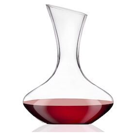 Clear glass wine decanter with a wide base and narrow neck, partially filled with red wine