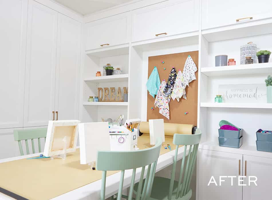Bright craft room with built-in shelves, a worktable, green chairs, and a corkboard with fabric swatches
