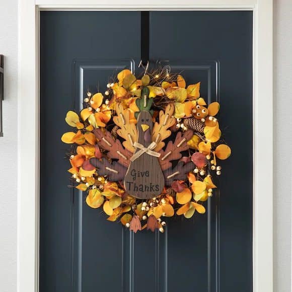 Festive Thanksgiving wreath hanging on a dark blue door