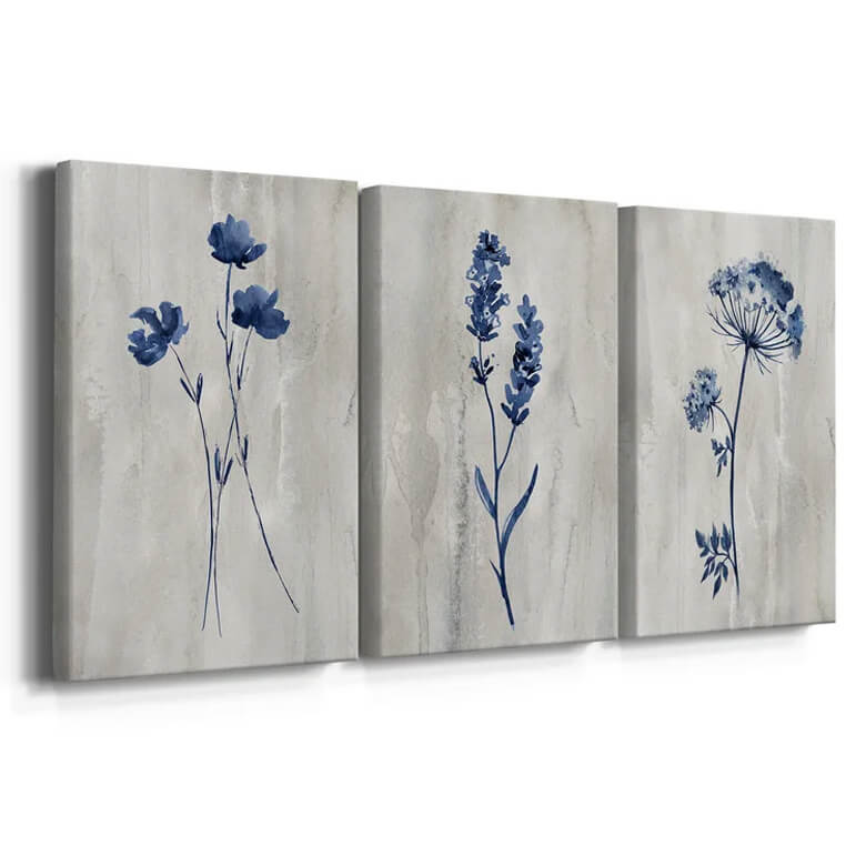 Set of three canvas prints featuring minimalist blue botanical illustrations on a light textured background