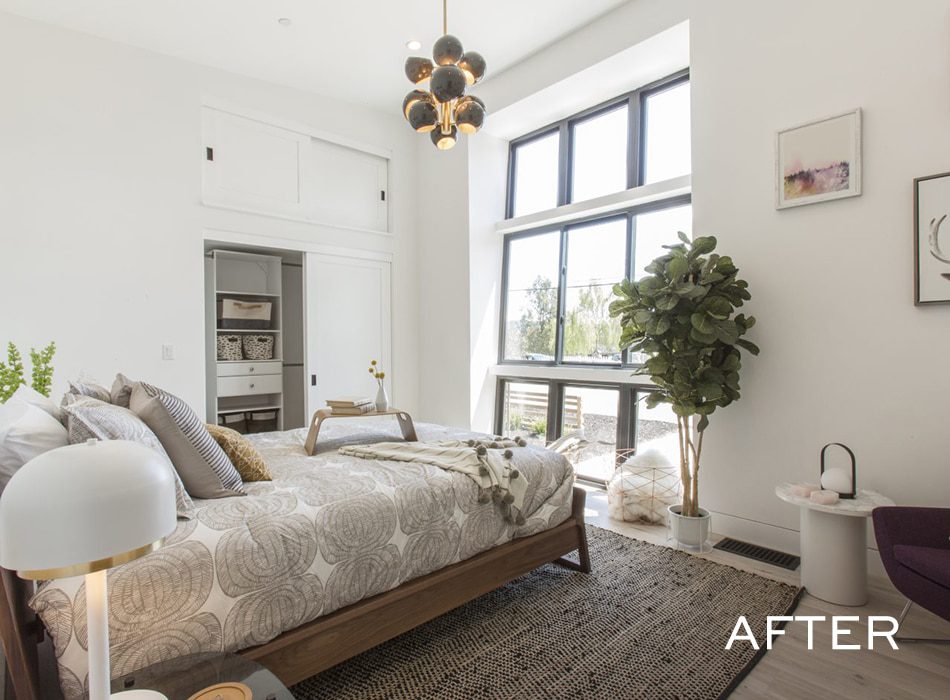 Bright modern bedroom with large windows, neutral decor, and potted plant
