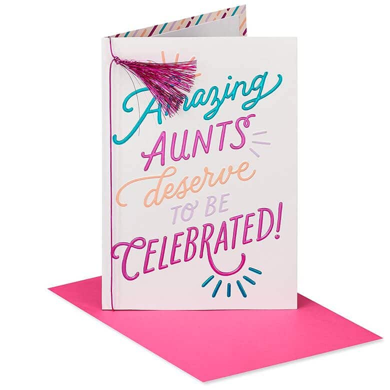 Greeting card with colorful text “Amazing Aunts Deserve to Be Celebrated!” and a pink tassel