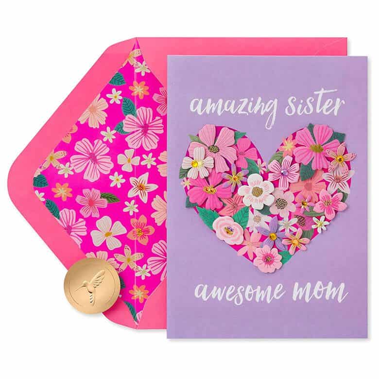 Purple greeting card with a floral heart design and the text “Amazing Sister Awesome Mom.”