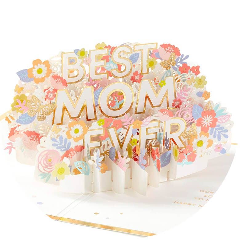 Pop-up greeting card with colorful flowers and bold gold letters reading “Best Mom Ever.”
