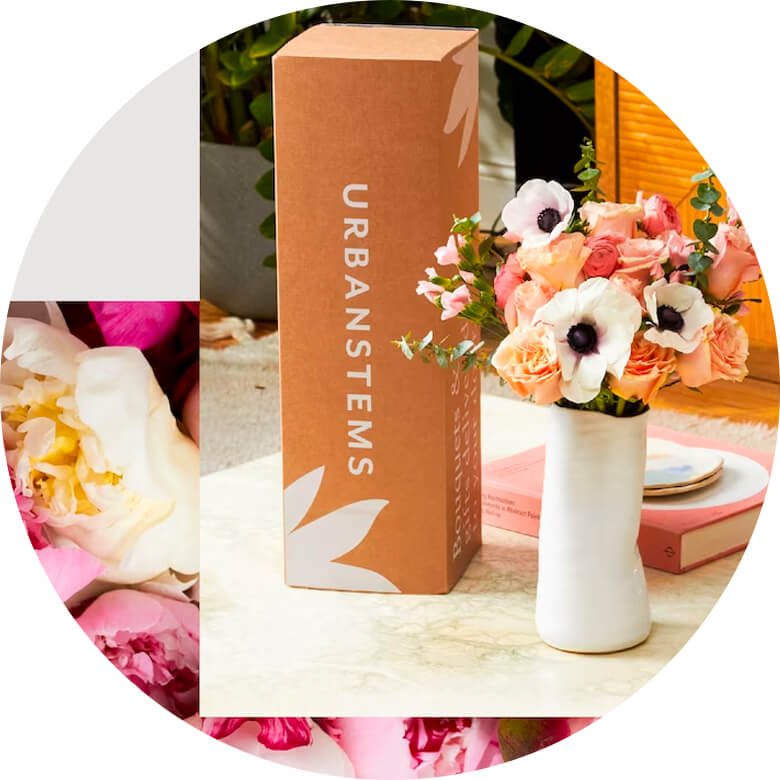 UrbanStems flower delivery box with a vase of pink and white flowers on a table