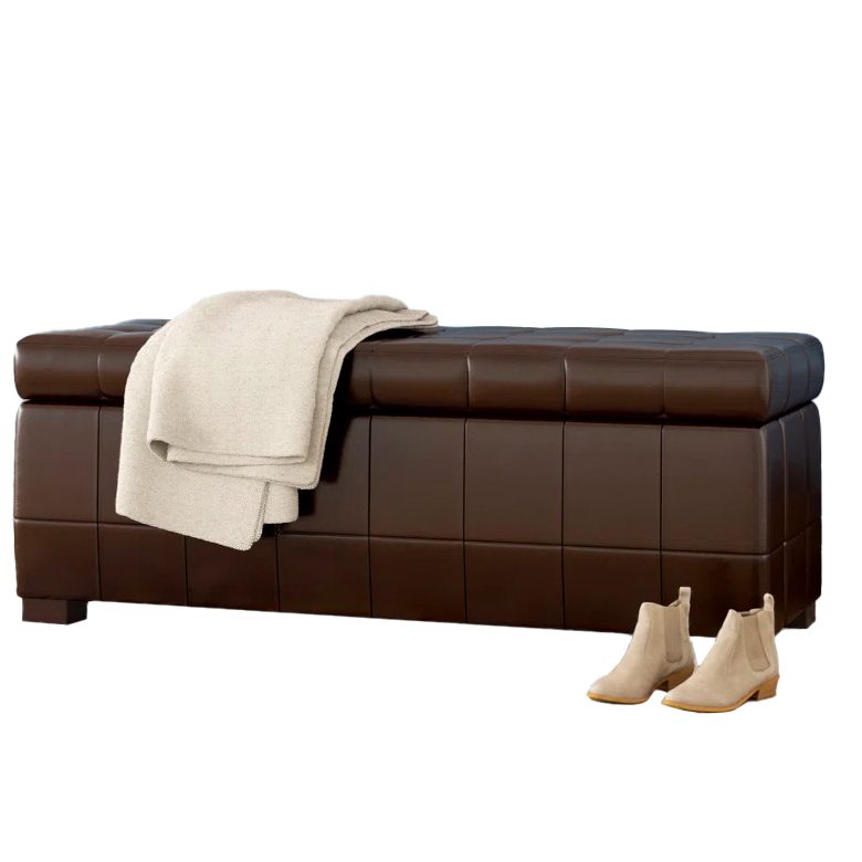 Brown leather storage bench with a folded cream blanket on top and beige ankle boots beside it