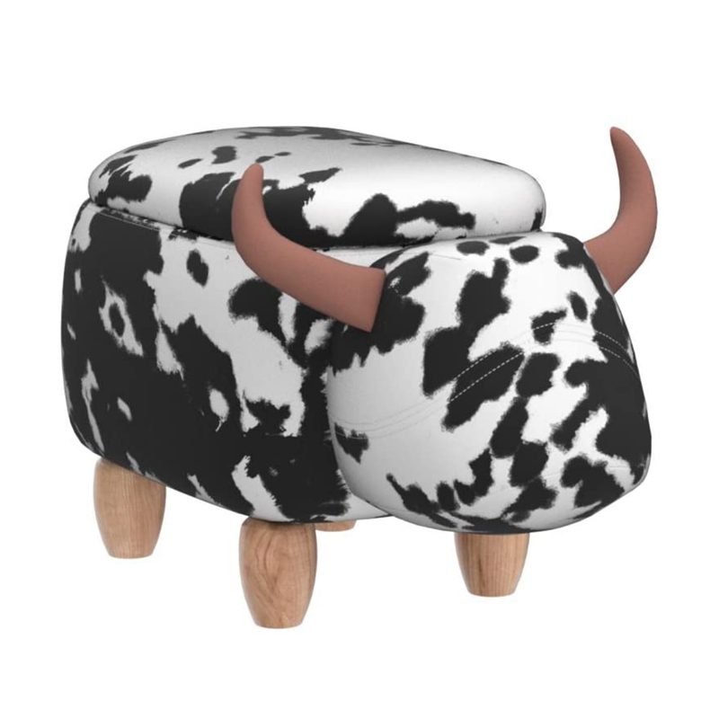 Cow-print ottoman shaped like a bull with wooden legs and brown horns