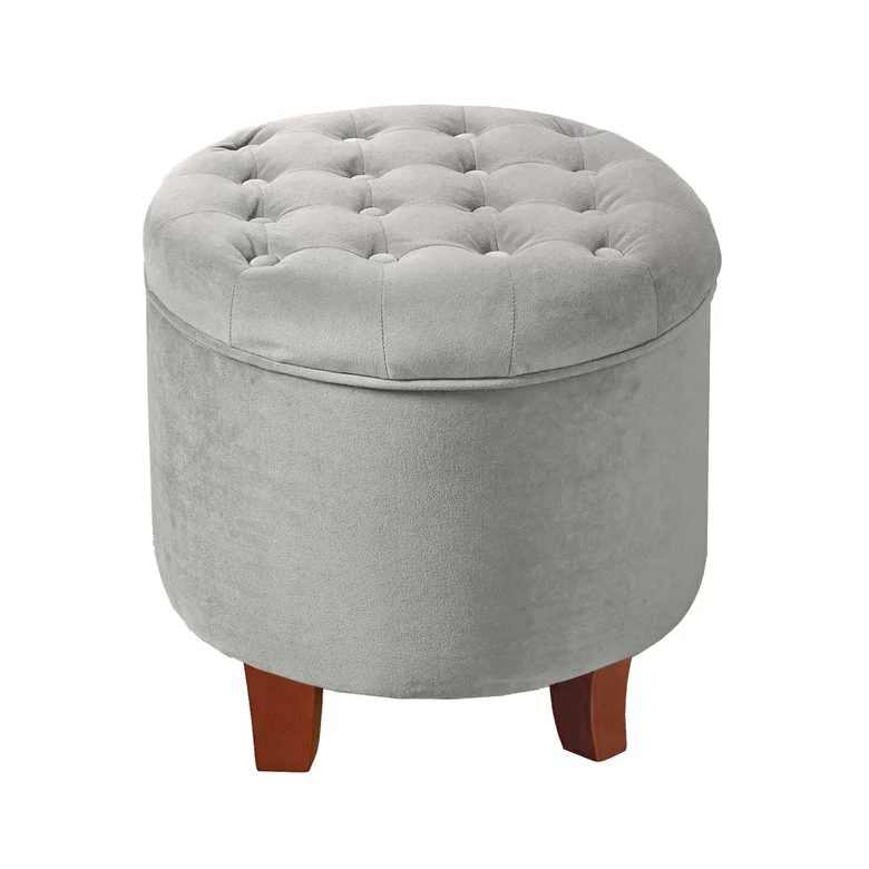 Round gray tufted ottoman with wooden legs