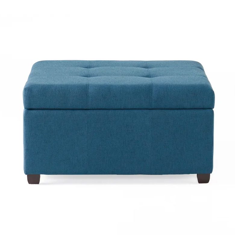 Rectangular blue tufted storage ottoman with short wooden legs