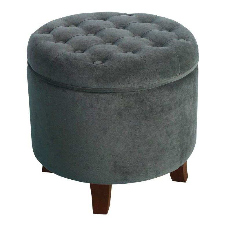 Round dark gray tufted ottoman with wooden legs