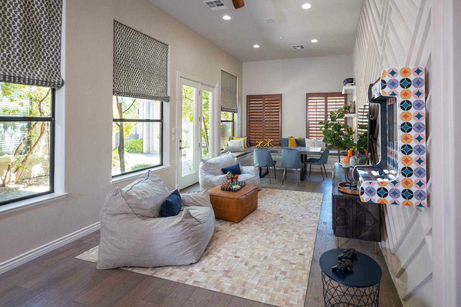 Cozy living and dining room with bean bags and corner bench seating