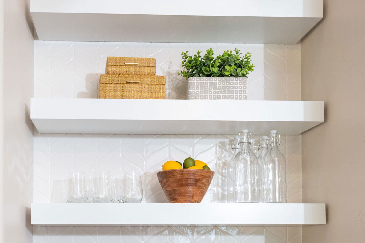 Neatly arranged set of white floating shelves