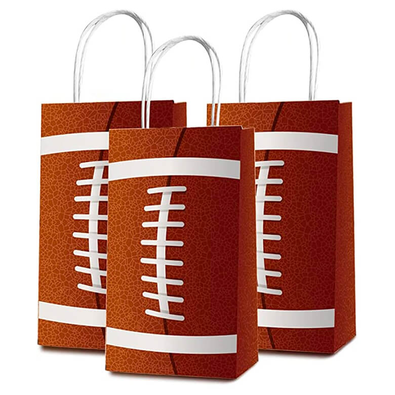 Three gift bags designed like footballs with white laces, standing upright