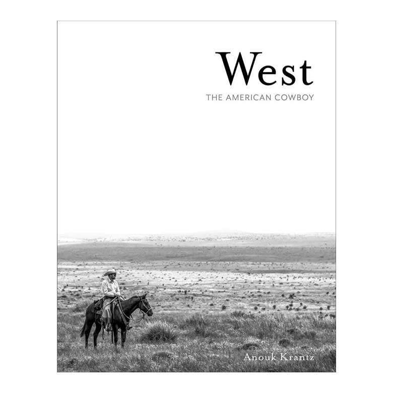 Book cover with cowboy on horseback in open field