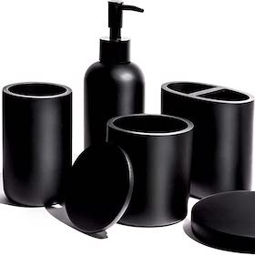 Matte black bathroom accessory set with soap dispenser and containers