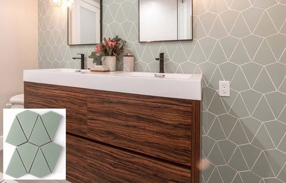 A bathroom featuring a double vanity with a wood finish, geometric patterned tiles, and sleek black fixtures