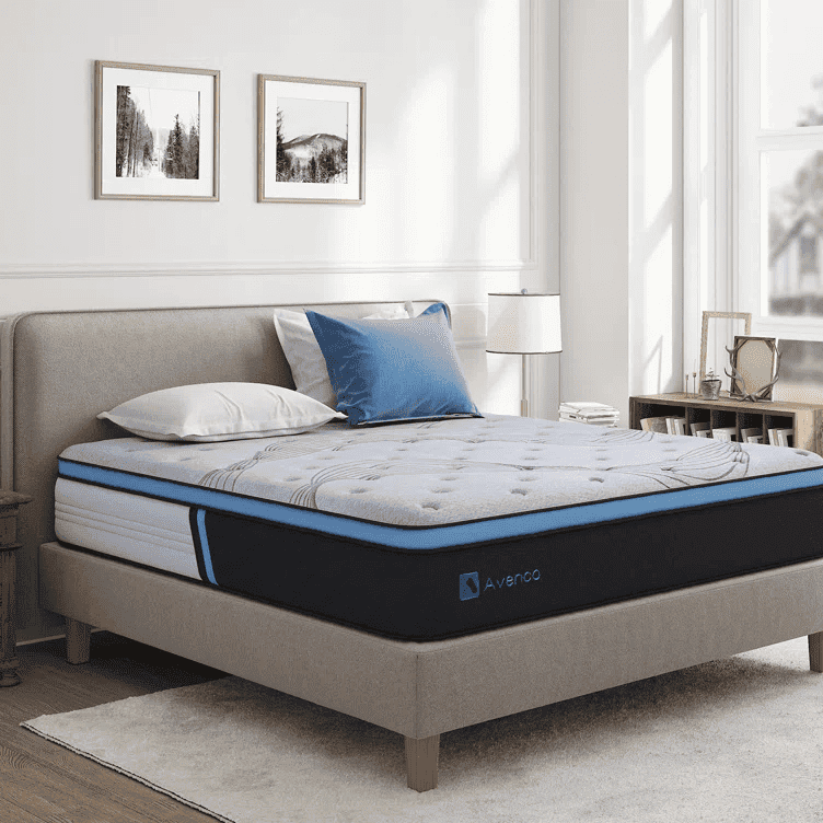 Bedroom with a gray upholstered bed frame and Avenco mattress topped with blue and white pillows