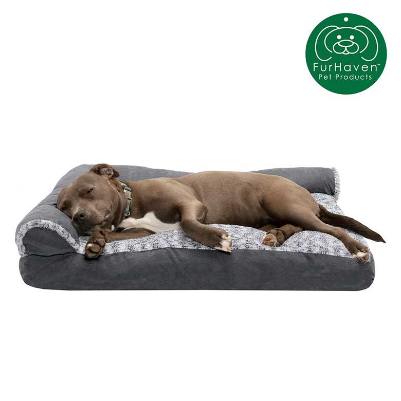 Gray dog sleeping on a plush FurHaven orthopedic pet bed