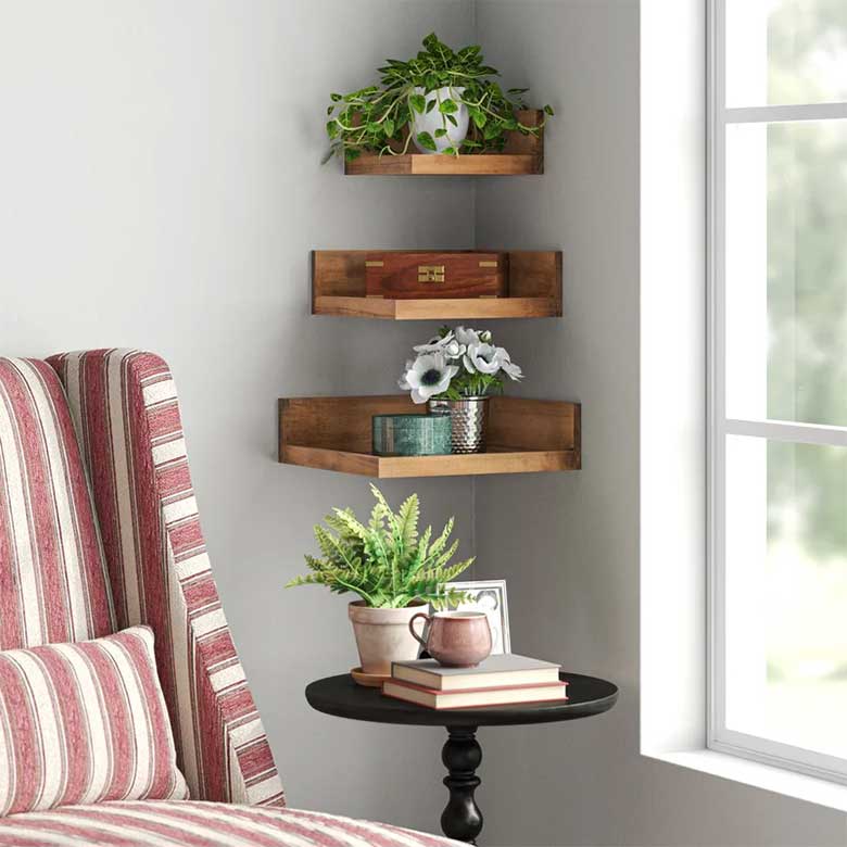 Cozy corner with wooden wall shelves, plants, books, and a striped armchair