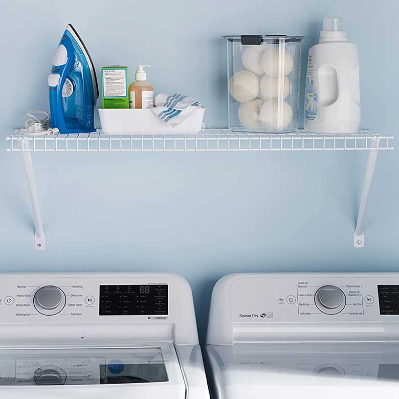 Organized laundry room with a white shelf holding an iron, detergent, dryer balls, and supplies.