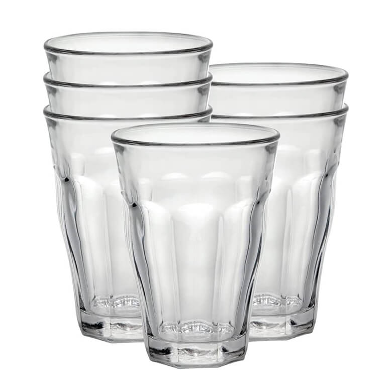 Set of six clear drinking glasses with fluted design