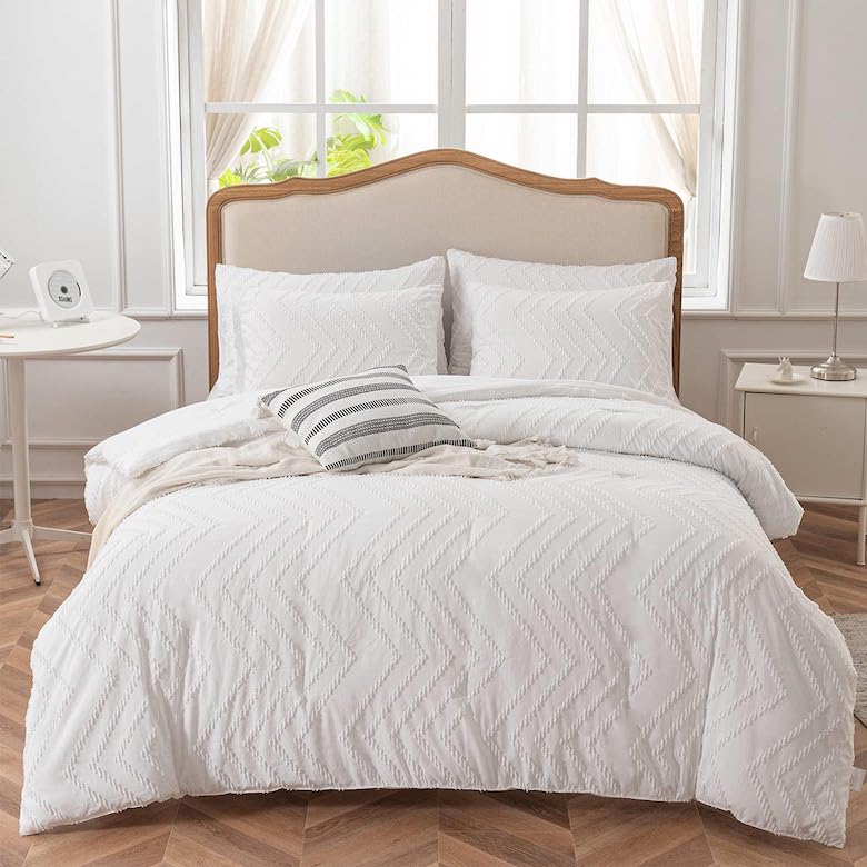Cozy white chevron bedding with striped accent pillows
