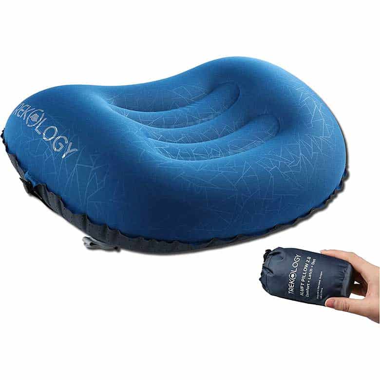 Compact blue inflatable camping pillow with ergonomic design and a portable carrying pouch