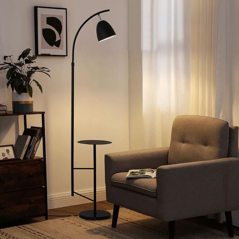 Cozy reading nook with armchair, floor lamp, and side table