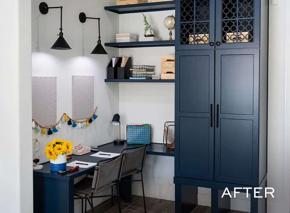An after image of a home office with navy blue wall cabinet, shelves, desk, and chairs