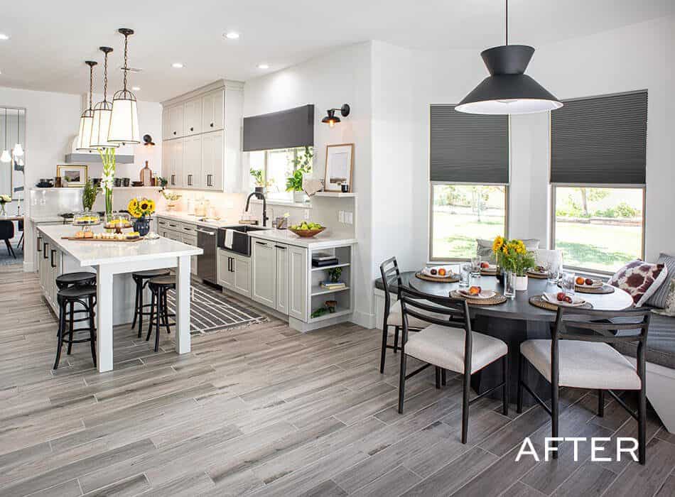 A modern farmhouse kitchen and dining room with two tables, white counters, and a large island with a breakfast bar