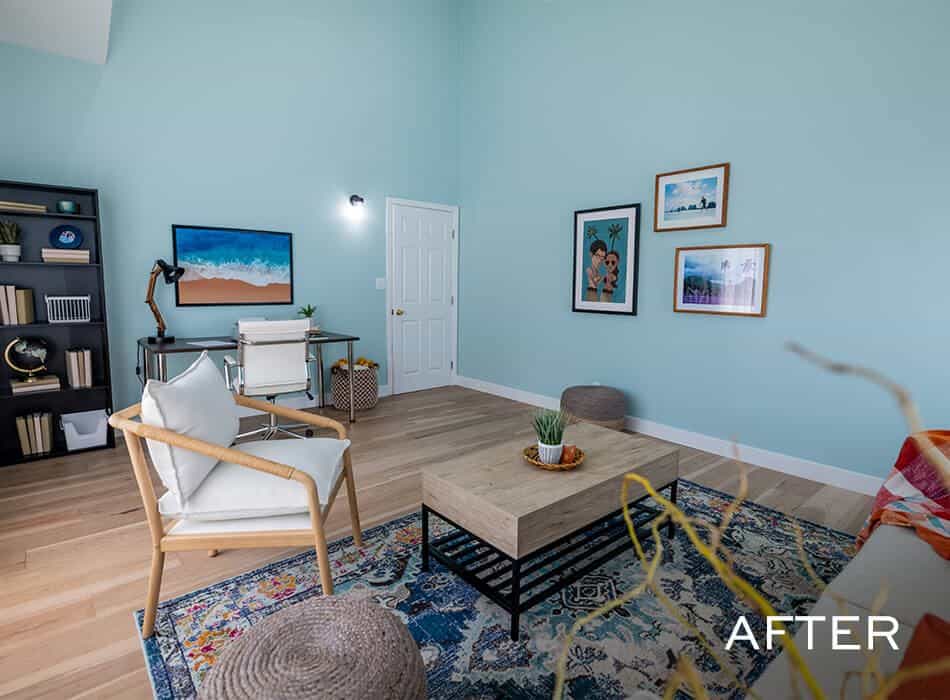 Bright living room with teal walls, modern furniture and white door in the corner