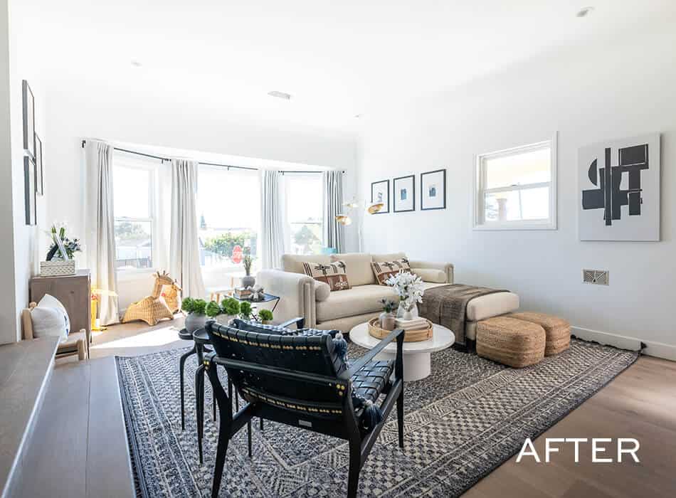 Bright and modern living room with neutral decor, large windows, and textured accents