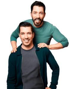 Scott brothers smiling and posing together, one standing behind the other