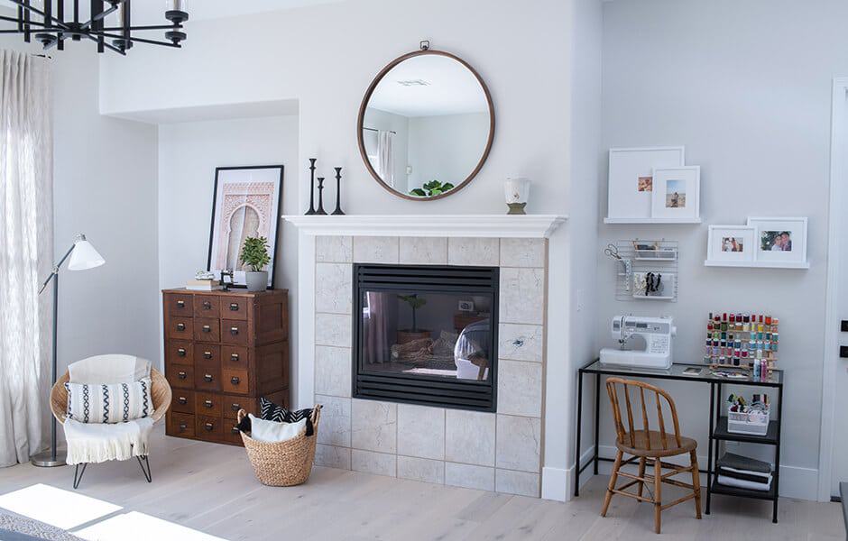 Cozy living room with a fireplace and a workspace