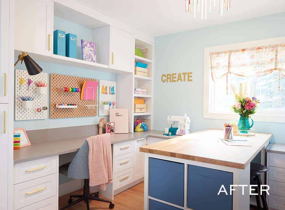 Bright craft room with built-in storage, pegboards, large worktable, and colorful supplies