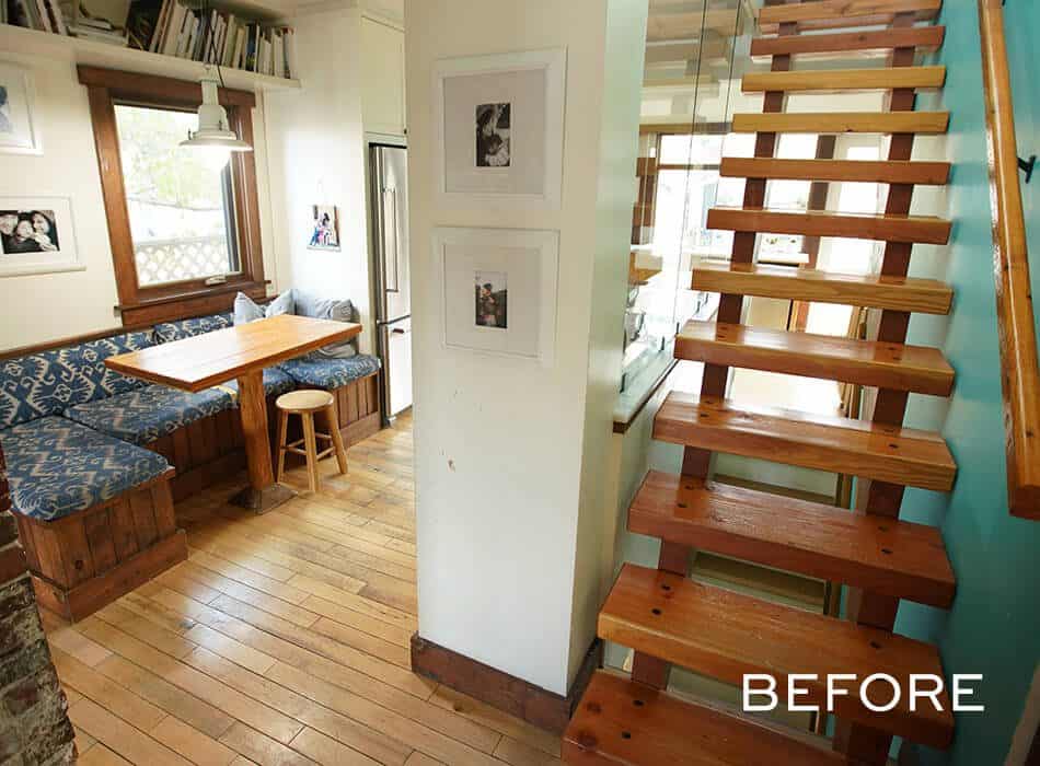 Before photo of a dining area with wooden table, bench seating, stool, and a staircase