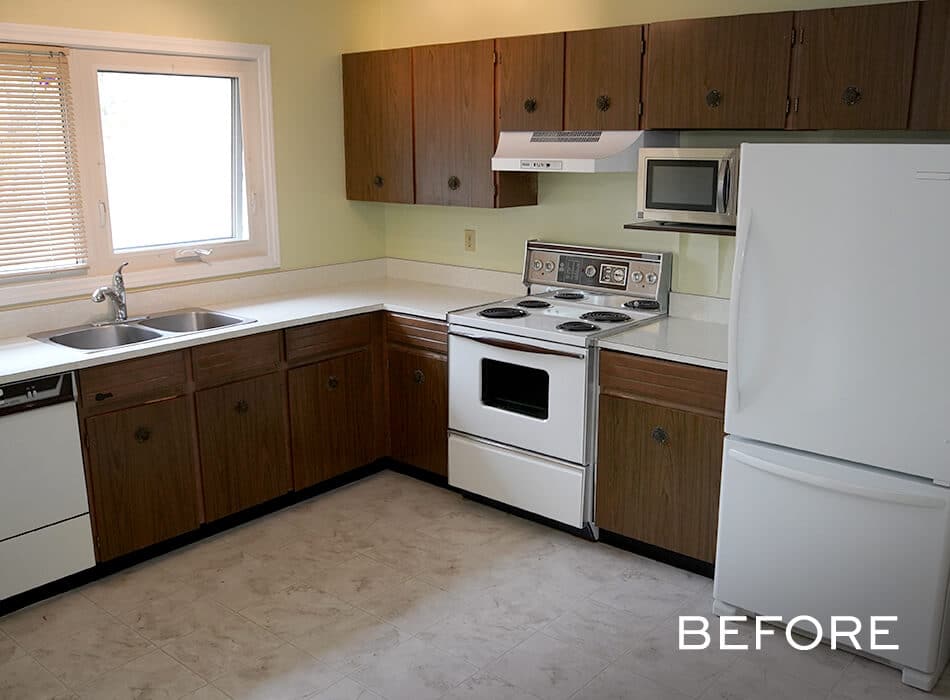 Dated kitchen with wood cabinets, white appliances, and beige countertops