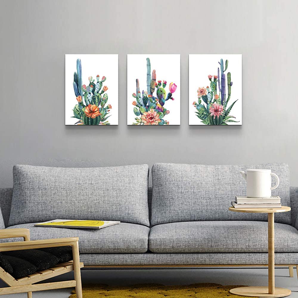 Living room with a gray sofa, round side table, and three cactus-themed wall art pieces