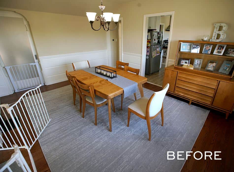Simple dining room setup with wooden furniture and a gray rug