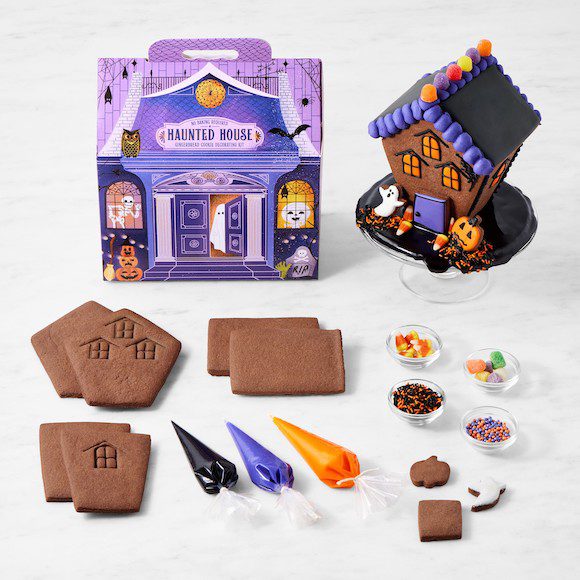 Haunted house cookie kit with cookie pieces, icing, and Halloween decorations