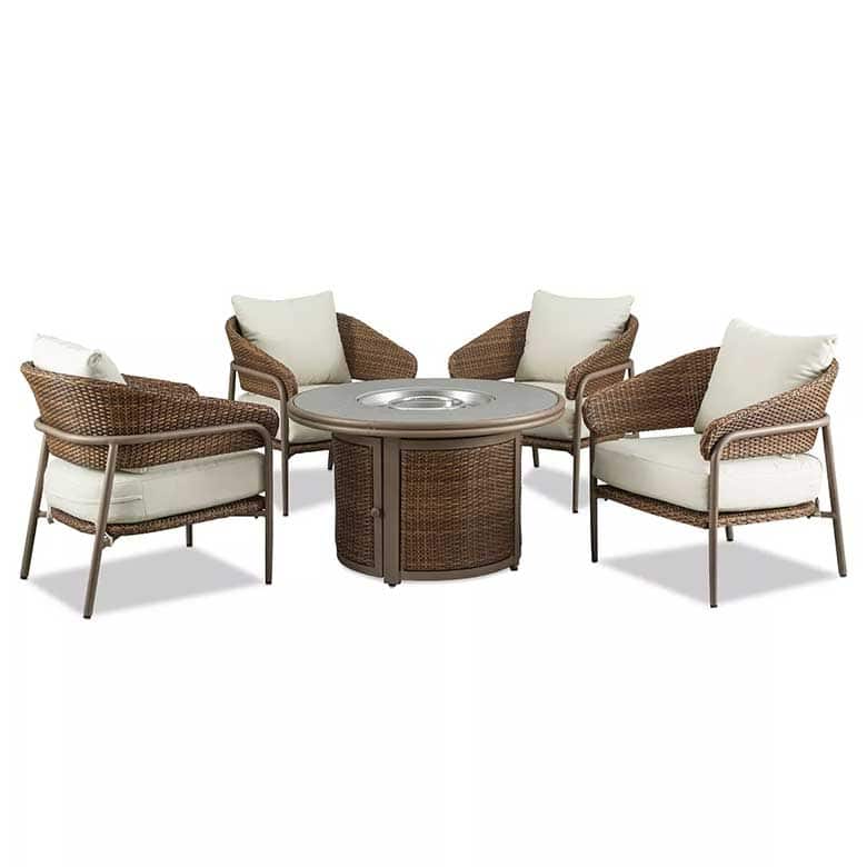 Outdoor wicker seating set with four cushioned chairs and a round fire pit table