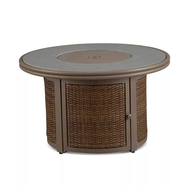 Round wicker fire pit table with a flat top and storage compartment