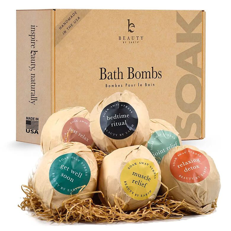 Box set of bath bombs labeled with different uses such as bedtime ritual, muscle relief, and relaxing detox