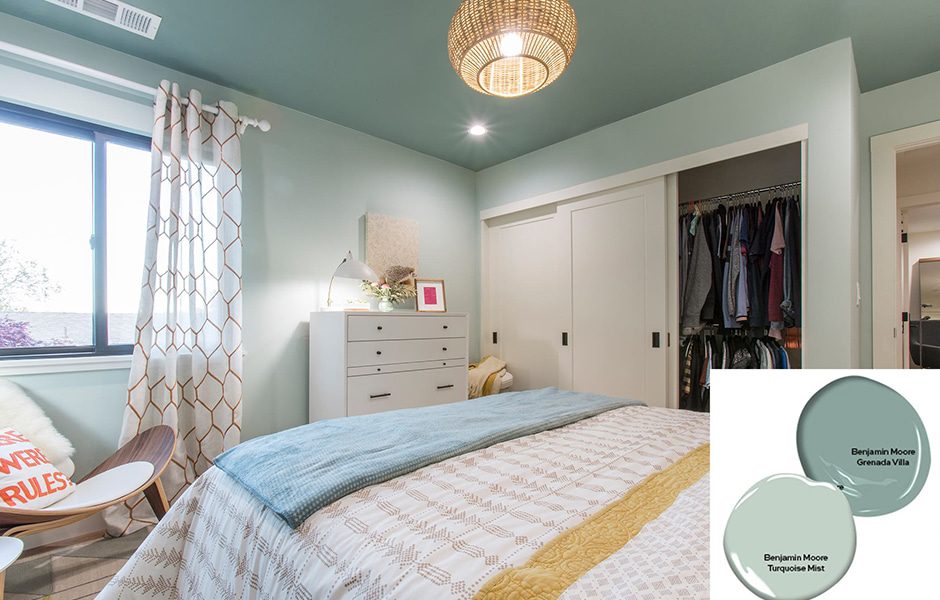 Cozy bedroom with teal ceiling, light walls, and a white dresser, featuring a closet and a window