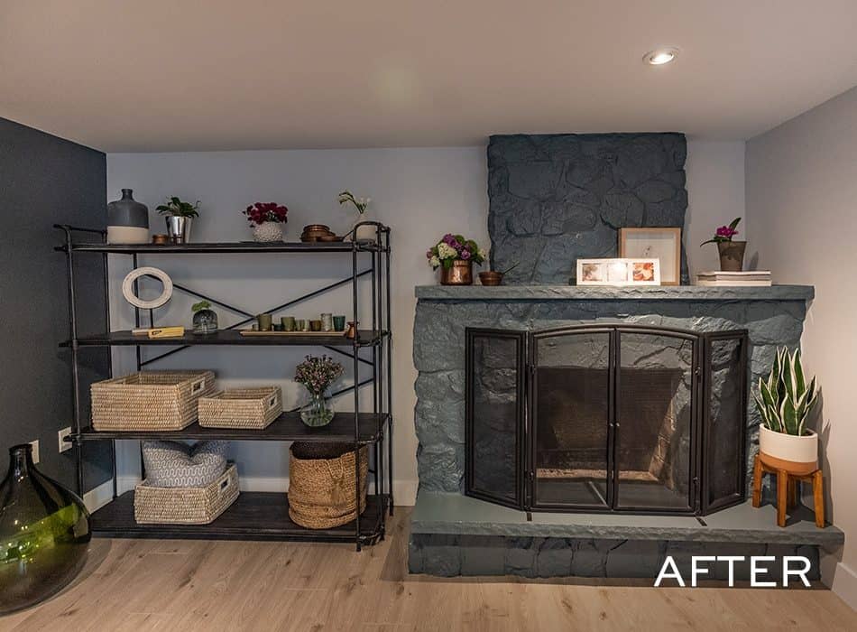 An after image of a modernized fireplace with a sleek stone finish and stylish shelving for a modern touch