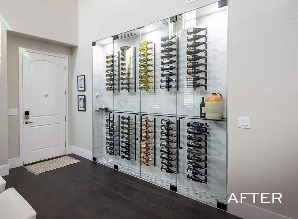 An after image of a wine storage wall with glass panels and organized racks in a modern entryway
