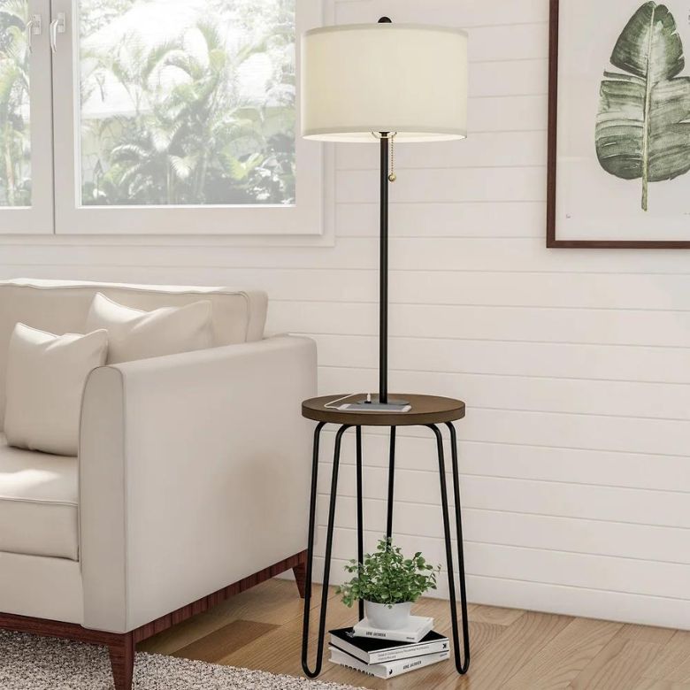 Floor lamp with an integrated side table beside a neutral sofa